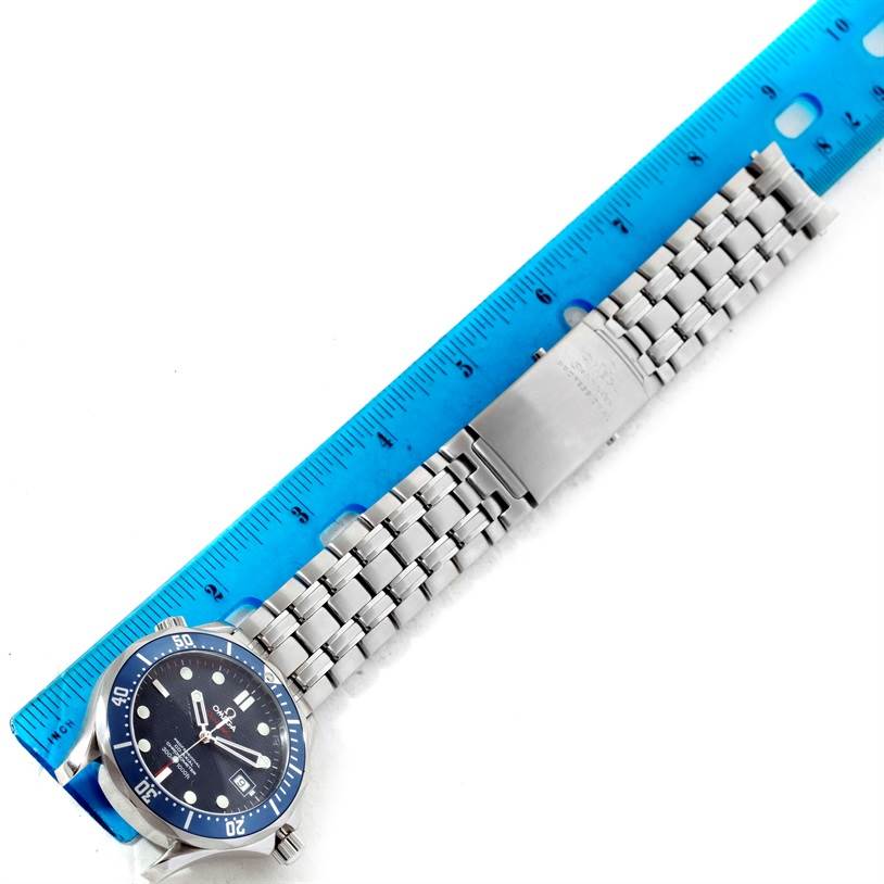 The Omega Seamaster 2220.80.00 Men
s Stainless Steel Blue Dial 2220.80.00 Men
s Stainless Steel Blue Dial watch is shown from a top-down angle, including the face, bezel, and metal bracelet with a ruler for scale.