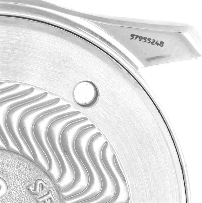 This is a close-up of the back case of an Omega Seamaster 2541.80.00 Men
s Stainless Steel Blue Dial 2541.80.00 Men
s Stainless Steel Blue Dial watch, showing part of the wavy engravings and serial number.