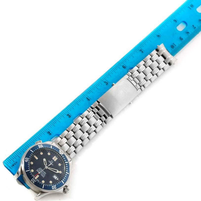 The image shows an Omega Seamaster 2531.80.00 Men
s Stainless Steel Blue Dial 2531.80.00 Men
s Stainless Steel Blue Dial watch viewed from above, positioned alongside a blue ruler.