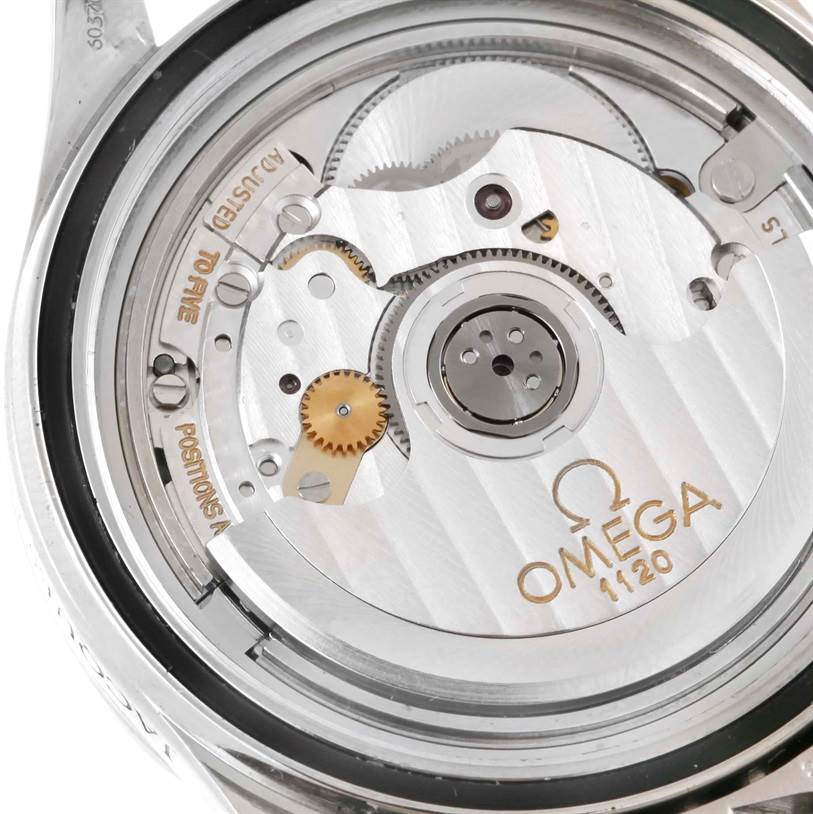 This image shows the intricate inner mechanism of an Omega Seamaster 2554.80.00 Men
s Stainless Steel Blue Dial 2554.80.00 Men
s Stainless Steel Blue Dial watch, highlighting gears and the rotor with model number 1120.