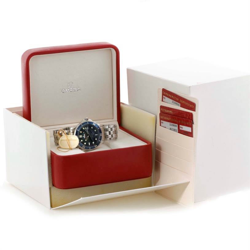 The image shows an Omega Seamaster 2220.80.00 Men
s Stainless Steel Blue Dial 2220.80.00 Men
s Stainless Steel Blue Dial watch and accessories in an open box with certificates on the side.