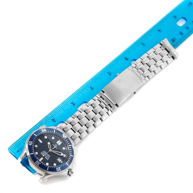 The image shows an Omega Seamaster 2531.80.00 Men
s Stainless Steel Blue Dial 2531.80.00 Men
s Stainless Steel Blue Dial watch laid flat beside a blue ruler, displaying the face, bezel, bracelet, and clasp.