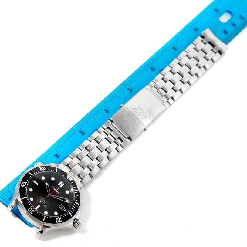 The image shows an Omega Seamaster 212.30.41.20.01.001 Men
s Stainless Steel Black Dial 212.30.41.20.01.001 Men
s Stainless Steel Black Dial watch positioned flat beside a blue ruler, highlighting its bracelet and clasp.