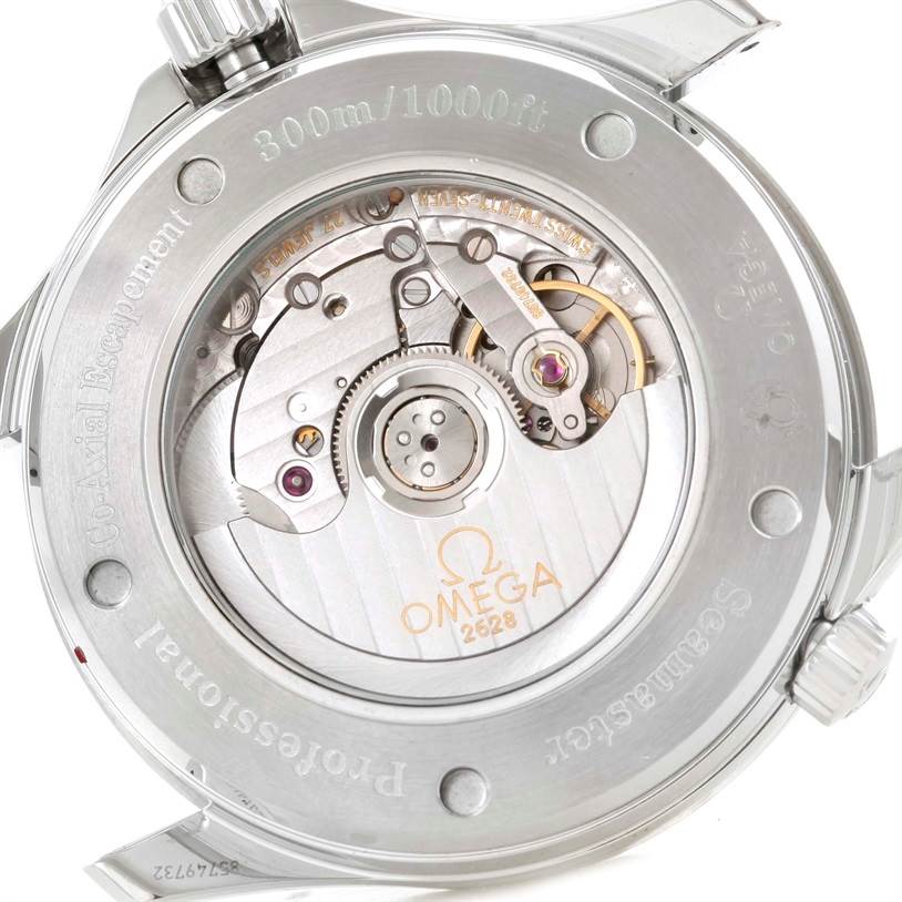 The image shows the back of an Omega Seamaster 2535.80.00 Men
s Stainless Steel Blue Dial 2535.80.00 Men
s Stainless Steel Blue Dial watch, highlighting its visible movement mechanism and engravings.