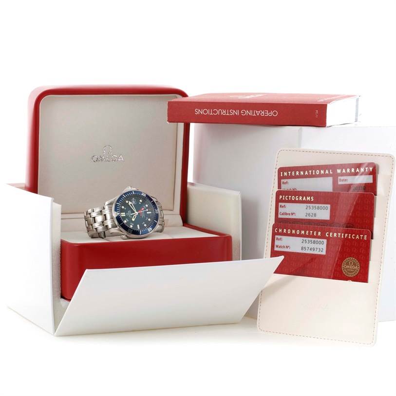 The image shows an Omega Seamaster 2535.80.00 Men
s Stainless Steel Blue Dial 2535.80.00 Men
s Stainless Steel Blue Dial watch in its open box, along with the operating instructions and warranty cards.