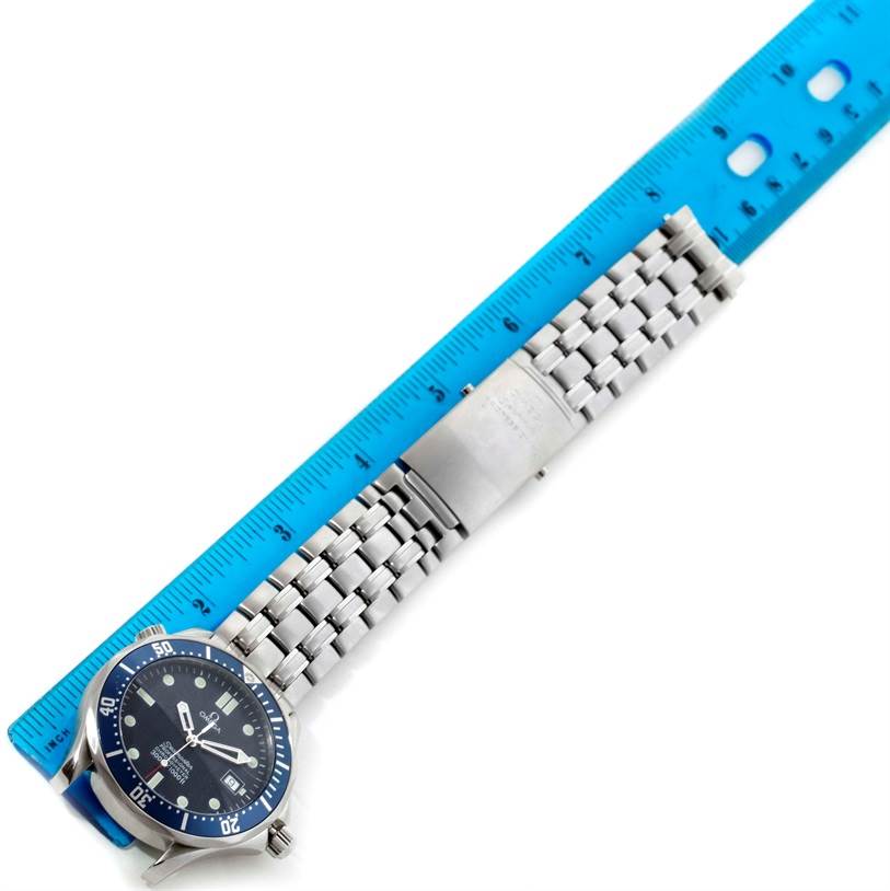 The image shows an Omega Seamaster 2531.80.00 Men
s Stainless Steel Blue Dial 2531.80.00 Men
s Stainless Steel Blue Dial watch laid flat with its bracelet extended alongside a blue ruler for measurement.