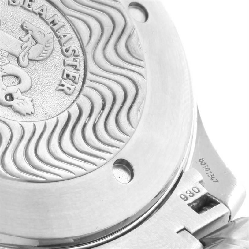 The image shows the case back of an Omega Seamaster 2534.50.00 Men
s Stainless Steel Black Dial 2534.50.00 Men
s Stainless Steel Black Dial watch at an oblique angle, featuring its engraved design and part of the bracelet.