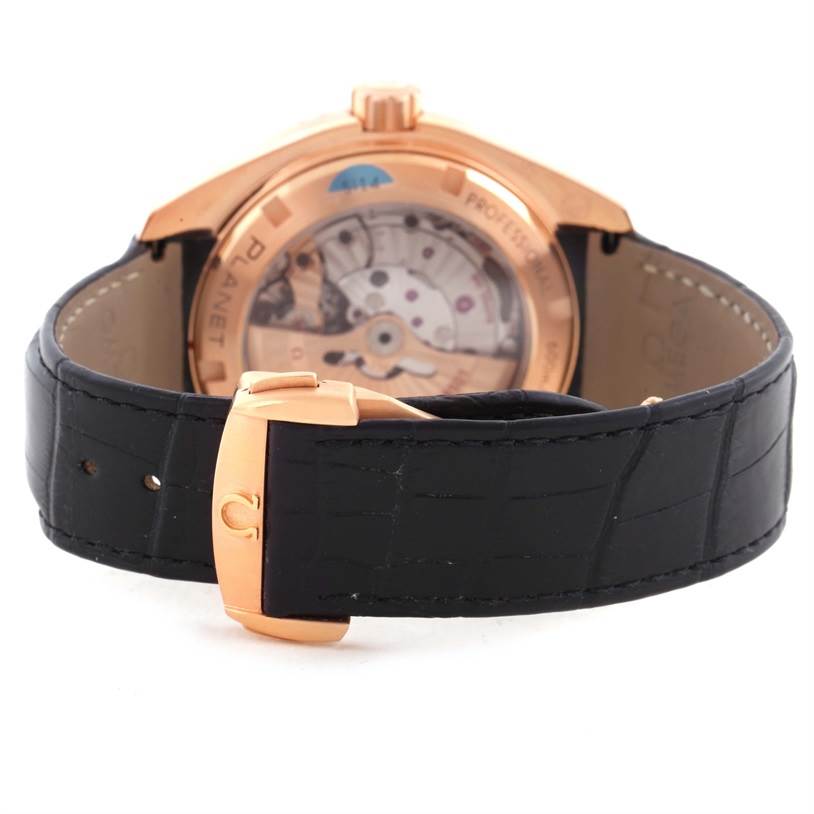 The image shows the back view of an Omega Seamaster 232.63.46.21.01.001 Men
s Black Dial 232.63.46.21.01.001 Men
s Black Dial watch, highlighting the open case back and black leather strap with a rose-gold clasp.