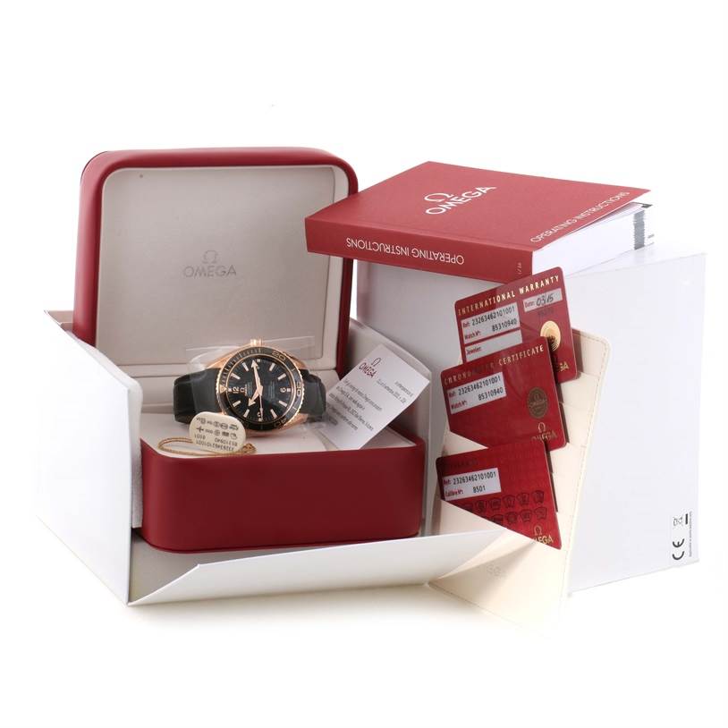 The image shows an Omega Seamaster 232.63.46.21.01.001 Men
s Black Dial 232.63.46.21.01.001 Men
s Black Dial watch in its box, alongside operating instructions, warranty cards, and a certificate.