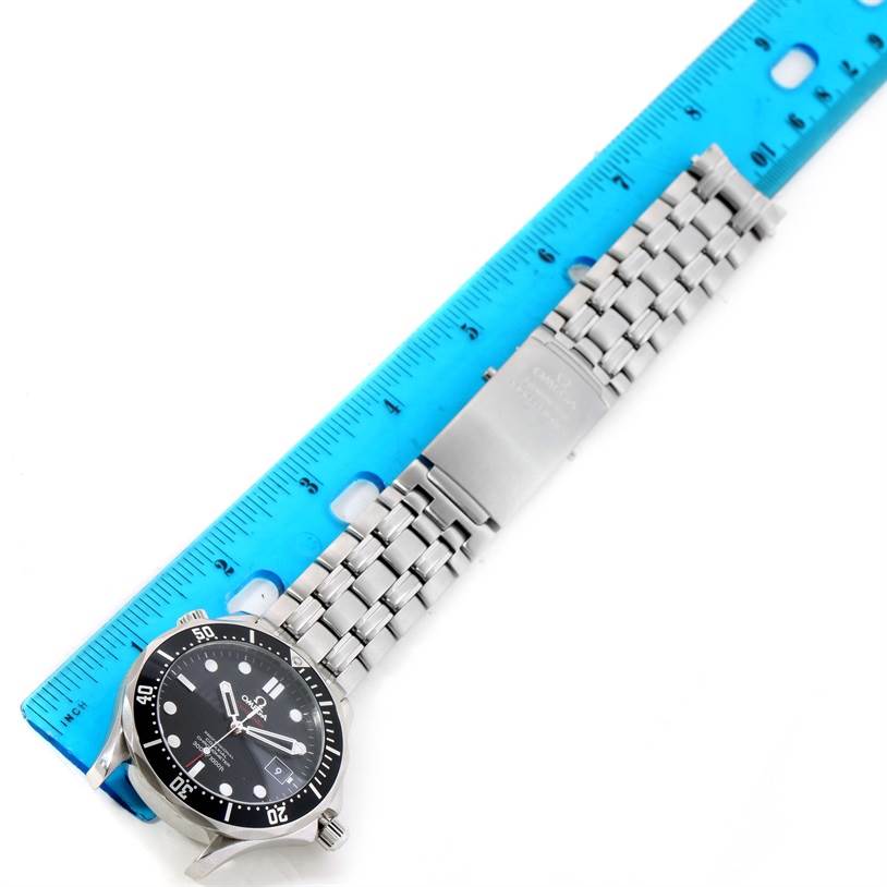 The Omega Seamaster 212.30.41.20.01.002 Men
s Stainless Steel Black Dial 212.30.41.20.01.002 Men
s Stainless Steel Black Dial watch is shown flat with its face, bracelet, and clasp visible, alongside a blue ruler for scale.