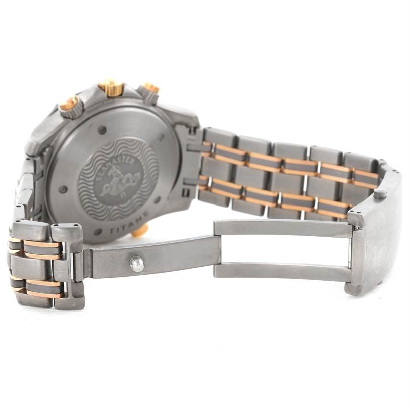 The image shows the back and clasp of an Omega Seamaster 2296.80.00 Men's Titanium Blue Dial 2296.80.00 Men's Titanium Blue Dial watch, highlighting the bracelet and engraved case back.