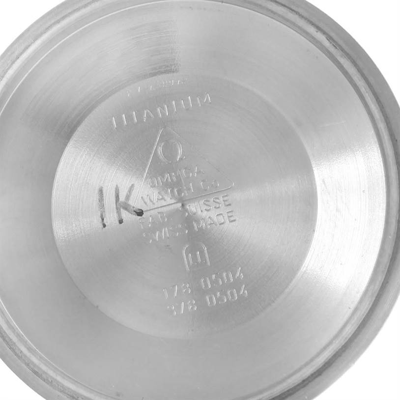 This image shows the inside case back of an Omega Seamaster 2296.80.00 Men's Titanium Blue Dial 2296.80.00 Men's Titanium Blue Dial watch, featuring engraved model details and material information.