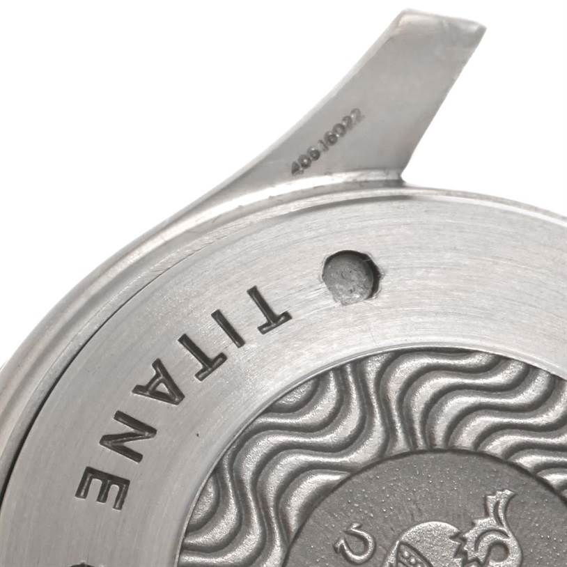 Close-up view of the case back of an Omega Seamaster 2296.80.00 Men's Titanium Blue Dial 2296.80.00 Men's Titanium Blue Dial watch showing the titanium material label and partial serial number.