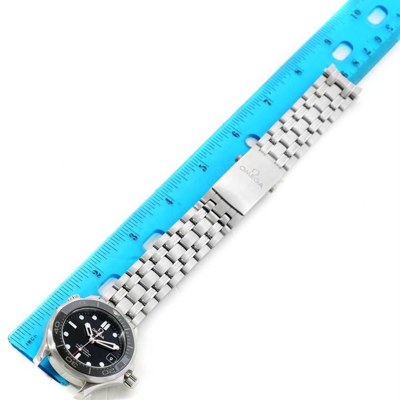 The image shows an Omega Seamaster 212.30.36.20.01.002 Men's Stainless Steel Black Dial 212.30.36.20.01.002 Men's Stainless Steel Black Dial watch laid flat with its face visible alongside a blue ruler for scale.