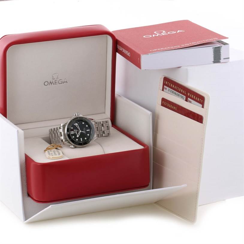 The Omega Seamaster 212.30.36.20.01.002 Men's Stainless Steel Black Dial 212.30.36.20.01.002 Men's Stainless Steel Black Dial watch is displayed in its open red and white box, along with warranty cards and an instruction booklet.