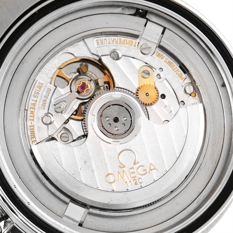 The image shows the intricate internal mechanism of an Omega Seamaster 2254.50.00 Men
s Stainless Steel Black Dial 2254.50.00 Men
s Stainless Steel Black Dial watch, focusing on the movement parts and the Omega logo.