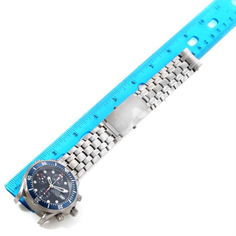 The image shows an Omega Seamaster 2298.80.00 Men's Titanium Blue Dial 2298.80.00 Men's Titanium Blue Dial watch, including its face, bezel, and metal bracelet with a ruler for scale.