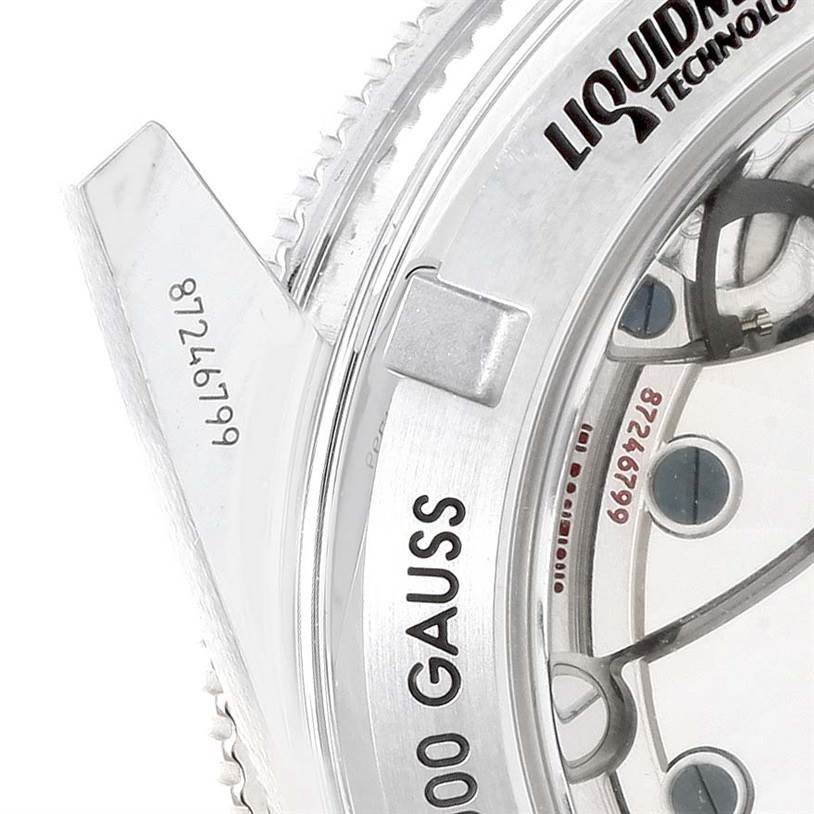 This image shows a close-up of the back of the Omega Seamaster 233.30.41.21.01.001 Stainless Steel Black Dial 233.30.41.21.01.001 Stainless Steel Black Dial watch, highlighting its Liquidmetal technology and details on the movement.