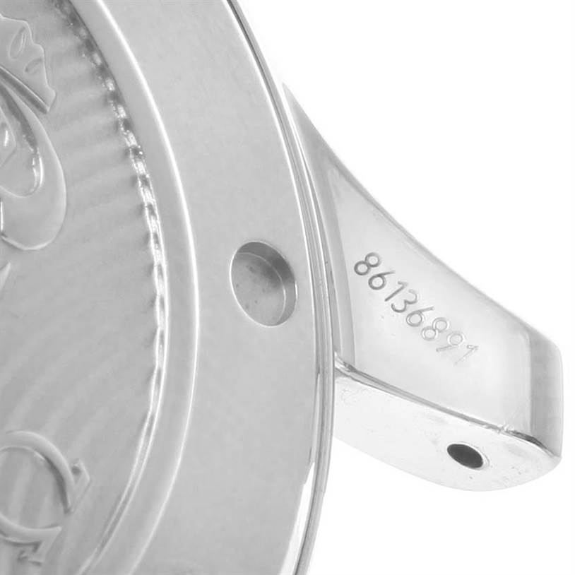 The image shows a close-up of the Omega Seamaster 212.30.41.20.01.003 Men
s Stainless Steel Black Dial 212.30.41.20.01.003 Men
s Stainless Steel Black Dial watch case back, serial number, and part of the strap attachment.