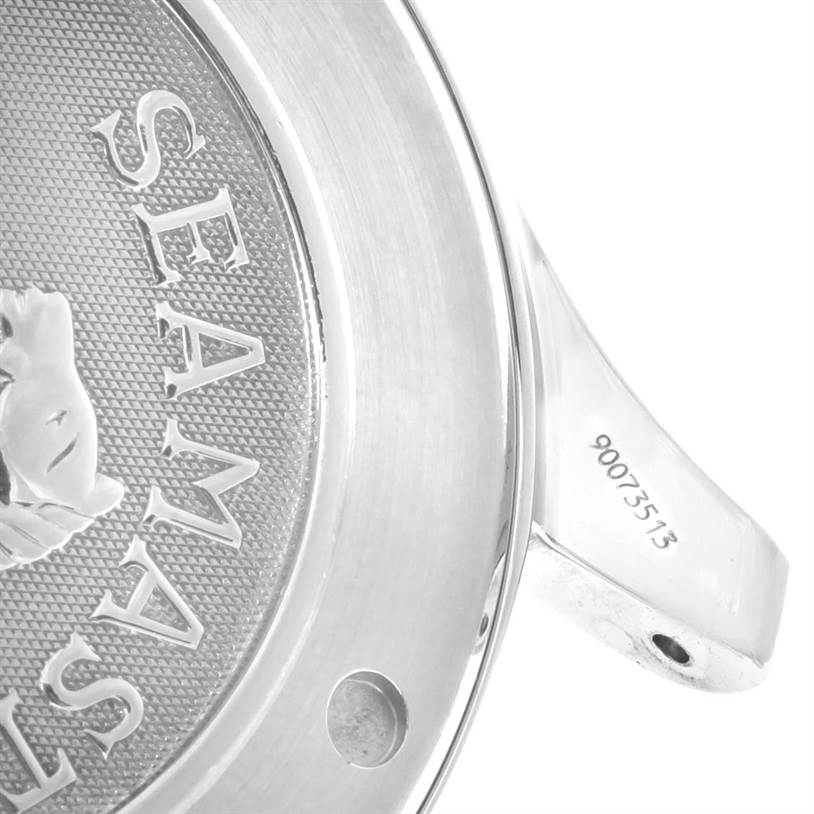 The image shows an angled close-up view of the Omega Seamaster 2221.80.00 Men
s Stainless Steel Blue Dial 2221.80.00 Men
s Stainless Steel Blue Dial
s case back and part of the bracelet with a serial number.