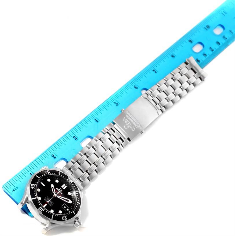 The Omega Seamaster 212.30.41.20.01.002 Men
s Stainless Steel Black Dial 212.30.41.20.01.002 Men
s Stainless Steel Black Dial watch is shown from a top-down angle, with the face and bracelet laid alongside a blue ruler for scale.