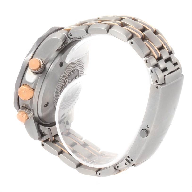 The image shows the side view of the Omega Seamaster 2296.80.00 Titanium Blue Dial 2296.80.00 Titanium Blue Dial watch, highlighting its crown, pushers, case back, and bracelet.