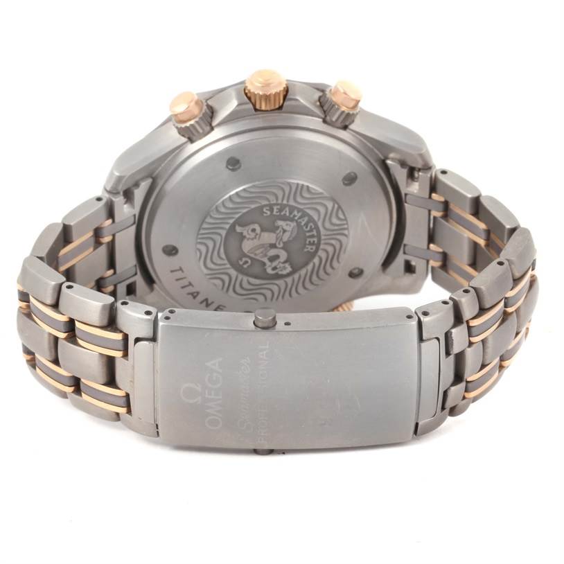 The image shows the back view of an Omega Seamaster 2296.80.00 Titanium Blue Dial 2296.80.00 Titanium Blue Dial watch, highlighting the case back, crown, and bracelet.