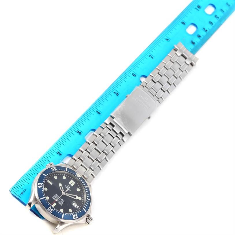 This image shows an Omega Seamaster 2531.80.00 Men
s Stainless Steel Blue Dial 2531.80.00 Men
s Stainless Steel Blue Dial watch placed next to a blue ruler, displaying the watch face and stainless steel bracelet.