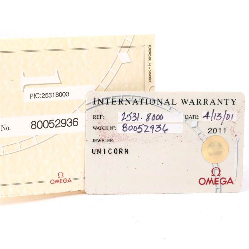 The image shows the warranty cards for the Omega Seamaster 2531.80.00 Men
s Stainless Steel Blue Dial 2531.80.00 Men
s Stainless Steel Blue Dial watch, displaying the reference number, watch number, jeweler, and date.