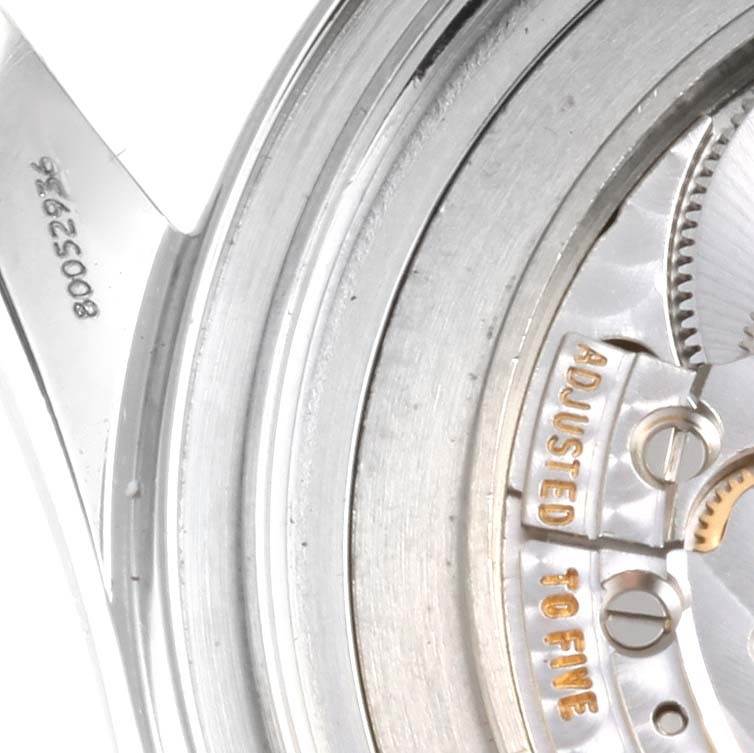 Close-up of the Omega Seamaster 2531.80.00 Men
s Stainless Steel Blue Dial 2531.80.00 Men
s Stainless Steel Blue Dial
s inner mechanism, focusing on the "Adjusted to Fine" engraving.