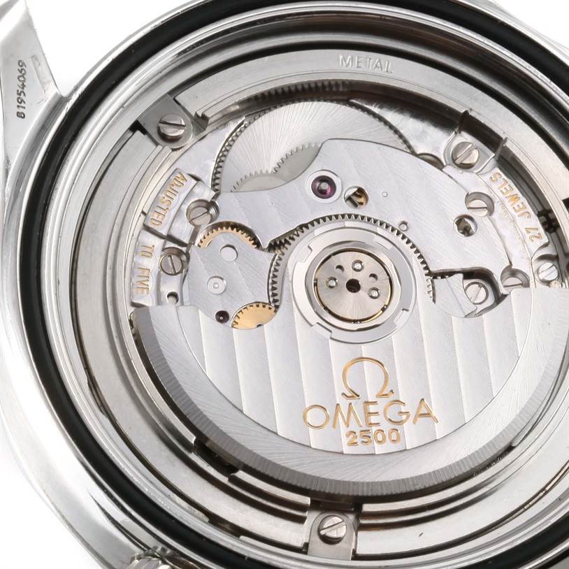 This image shows the movement of an Omega Seamaster 212.30.41.20.01.001 Men
s Stainless Steel Black Dial 212.30.41.20.01.001 Men
s Stainless Steel Black Dial watch, viewed from the back with its case opened.
