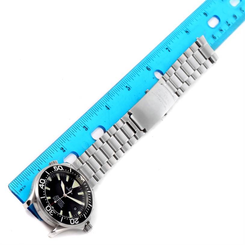 The image shows an Omega Seamaster 2254.50.00 Men's Stainless Steel Black Dial 2254.50.00 Men's Stainless Steel Black Dial watch laid flat next to a blue ruler, displaying the watch face and metal bracelet.