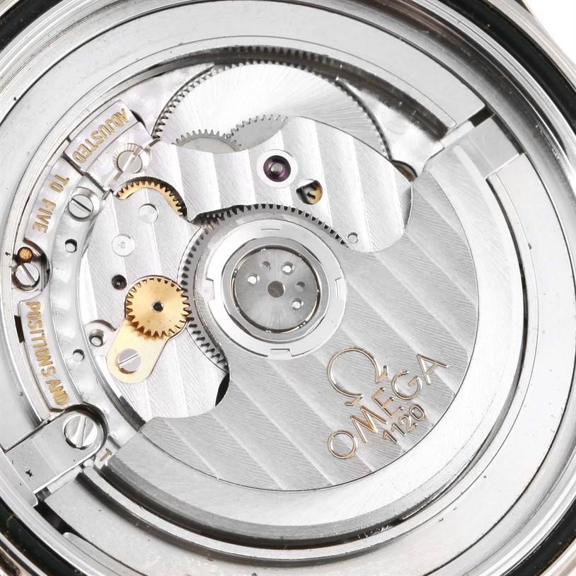 The image shows the internal mechanical movement of an Omega Seamaster 2254.50.00 Men's Stainless Steel Black Dial 2254.50.00 Men's Stainless Steel Black Dial watch, highlighting gears, jewels, and the Omega logo.