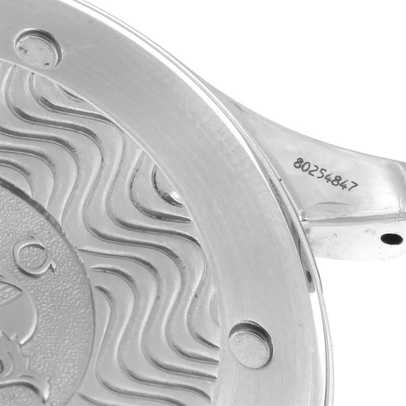 The image shows a close-up of the back case and lug of an Omega Seamaster 2254.50.00 Men's Stainless Steel Black Dial 2254.50.00 Men's Stainless Steel Black Dial watch, featuring engraved details and serial number.