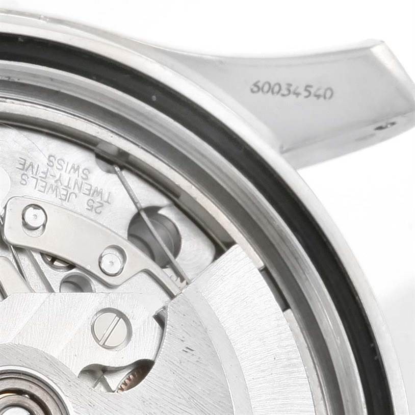 The image shows a close-up of the movement and serial number of the Omega Seamaster 2599.80.00 Men
s Stainless Steel Blue Dial 2599.80.00 Men
s Stainless Steel Blue Dial watch.