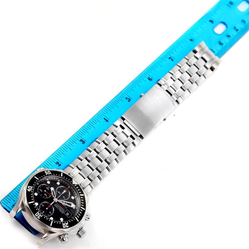 The image shows an Omega Seamaster 213.30.42.40.01.001 Men
s Stainless Steel Black Dial 213.30.42.40.01.001 Men
s Stainless Steel Black Dial watch laid flat with a ruler measuring its metal bracelet length.