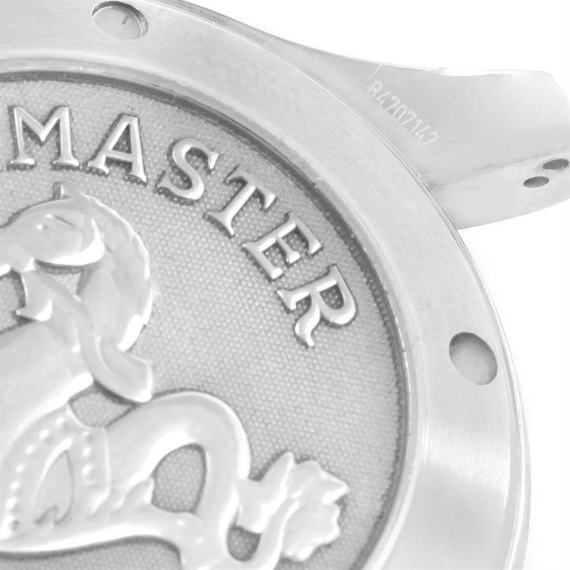 The image shows a close-up of the back case of an Omega Seamaster 213.30.42.40.01.001 Men
s Stainless Steel Black Dial 213.30.42.40.01.001 Men
s Stainless Steel Black Dial watch, displaying part of its logo and engraving.