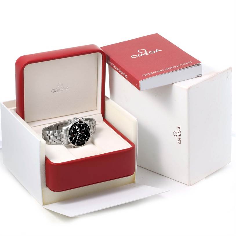 The Omega Seamaster 213.30.42.40.01.001 Men
s Stainless Steel Black Dial 213.30.42.40.01.001 Men
s Stainless Steel Black Dial watch is shown from a front angle, displayed in its red box with instructional manual beside it.