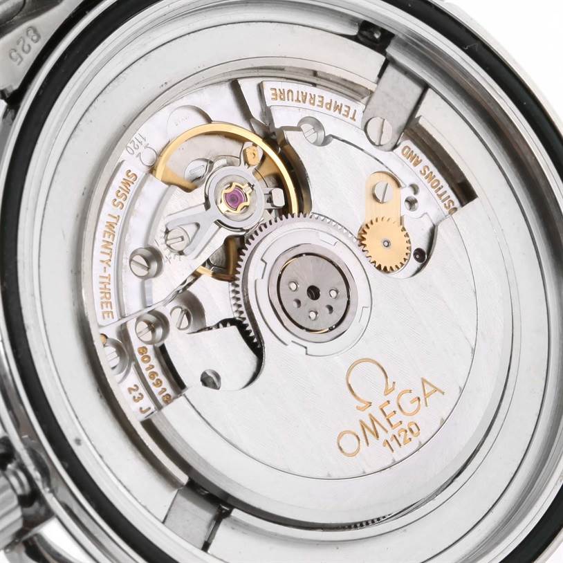 The image shows the internal mechanical movement of an Omega Seamaster 2531.80.00 Men
s Stainless Steel Blue Dial 2531.80.00 Men
s Stainless Steel Blue Dial watch, focusing on its gears and inscription details.