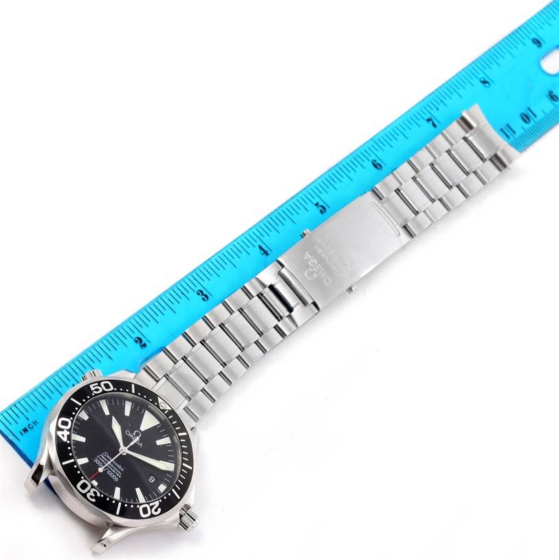 The image shows an Omega Seamaster 2254.50.00 Men
s Stainless Steel Black Dial 2254.50.00 Men
s Stainless Steel Black Dial watch laid flat next to a ruler, displaying the watch face and bracelet.