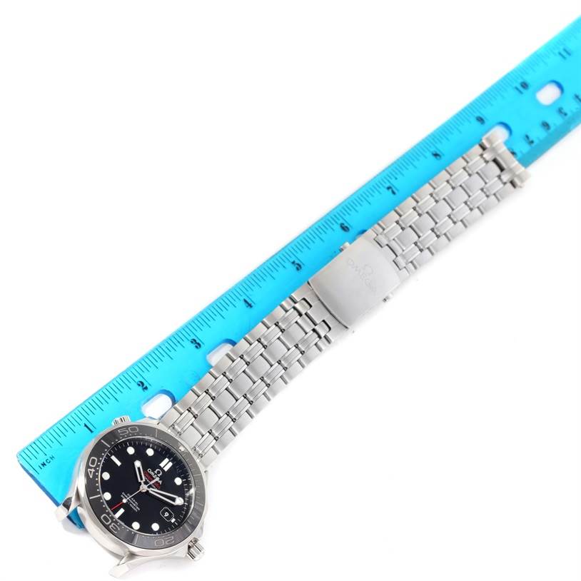 The image shows an Omega Seamaster 212.30.41.20.01.003 Men
s Stainless Steel Black Dial 212.30.41.20.01.003 Men
s Stainless Steel Black Dial watch laid flat, with its stainless steel bracelet and clasp visible, alongside a blue ruler for scale.