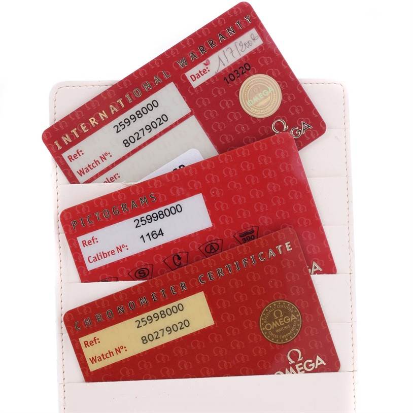 This image shows three red Omega Seamaster 2599.80.00 Men
s Stainless Steel Blue Dial 2599.80.00 Men
s Stainless Steel Blue Dial cards for warranty, pictograms, and chronometer certification in a holder.