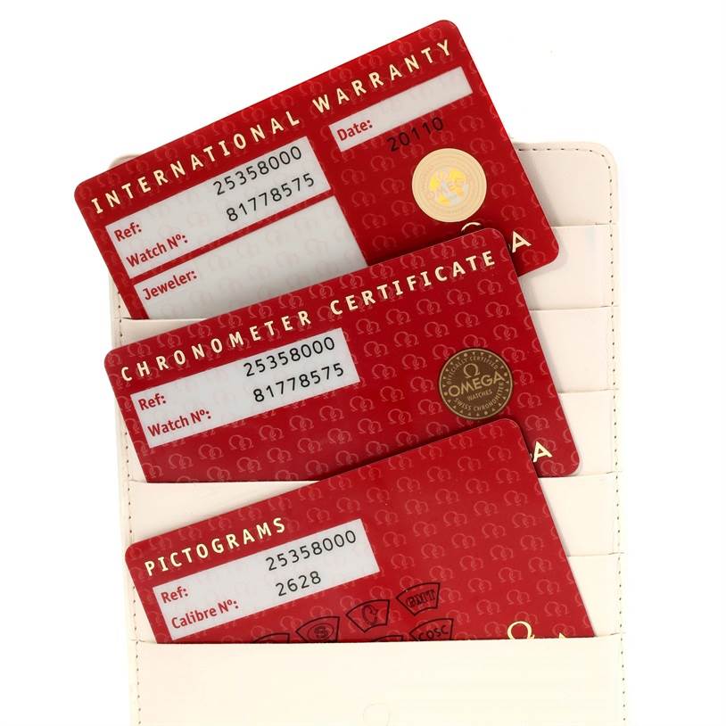 The image shows international warranty, chronometer certificate, and pictograms cards for the Omega Seamaster 2535.80.00 Men
s Stainless Steel Blue Dial 2535.80.00 Men
s Stainless Steel Blue Dial watch.