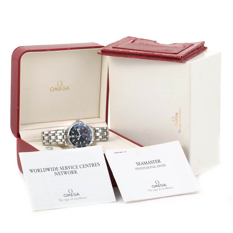 The image shows an Omega Seamaster 2561.80.00 Men
s Stainless Steel Blue Dial 2561.80.00 Men
s Stainless Steel Blue Dial watch in its open box with two booklets beside it.