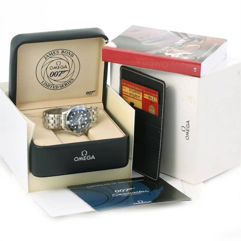 The Omega Seamaster 2226.80.00 Men
s Stainless Steel Blue Dial 2226.80.00 Men
s Stainless Steel Blue Dial watch is shown in its protective case, accompanied by warranty cards, brochures, and a special edition box.