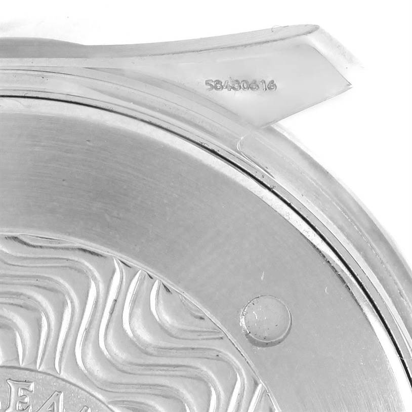 The image shows a close-up of the back case of an Omega Seamaster 2264.50.00 Men
s Stainless Steel Black Dial 2264.50.00 Men
s Stainless Steel Black Dial watch, highlighting part of the engraving and serial number.