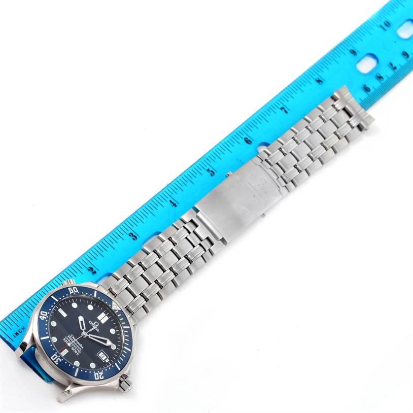 The Omega Seamaster 2531.80.00 Men
s Stainless Steel Blue Dial 2531.80.00 Men
s Stainless Steel Blue Dial watch is shown from a top-down angle, featuring the bezel, dial, and stainless steel bracelet alongside a ruler.