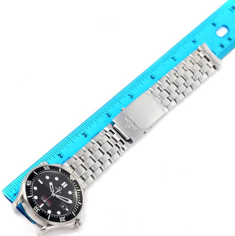 The image shows an Omega Seamaster 212.30.41.61.01.001 Men
s Stainless Steel Black Dial 212.30.41.61.01.001 Men
s Stainless Steel Black Dial watch laid flat with a blue ruler beside it, displaying the watch face, bracelet, and clasp.