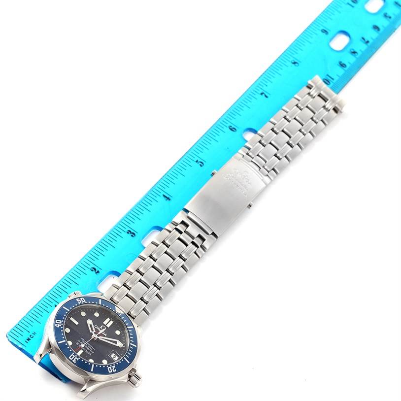 The image shows the Omega Seamaster 2222.80.00 Men
s Stainless Steel Blue Dial 2222.80.00 Men
s Stainless Steel Blue Dial watch lying flat, with a focus on the face, bezel, and metal bracelet alongside a ruler for scale.