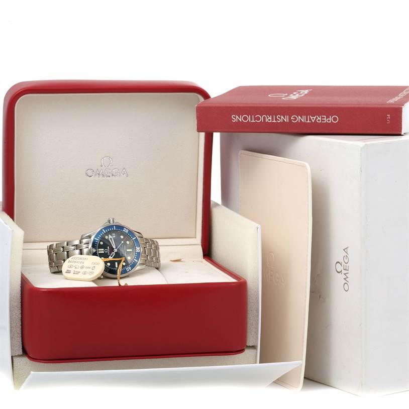 The Omega Seamaster 2222.80.00 Men
s Stainless Steel Blue Dial 2222.80.00 Men
s Stainless Steel Blue Dial watch is shown in its red display box alongside its operating instructions and outer packaging.
